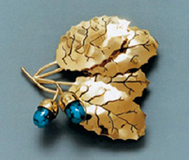 gold brooch with turquoise